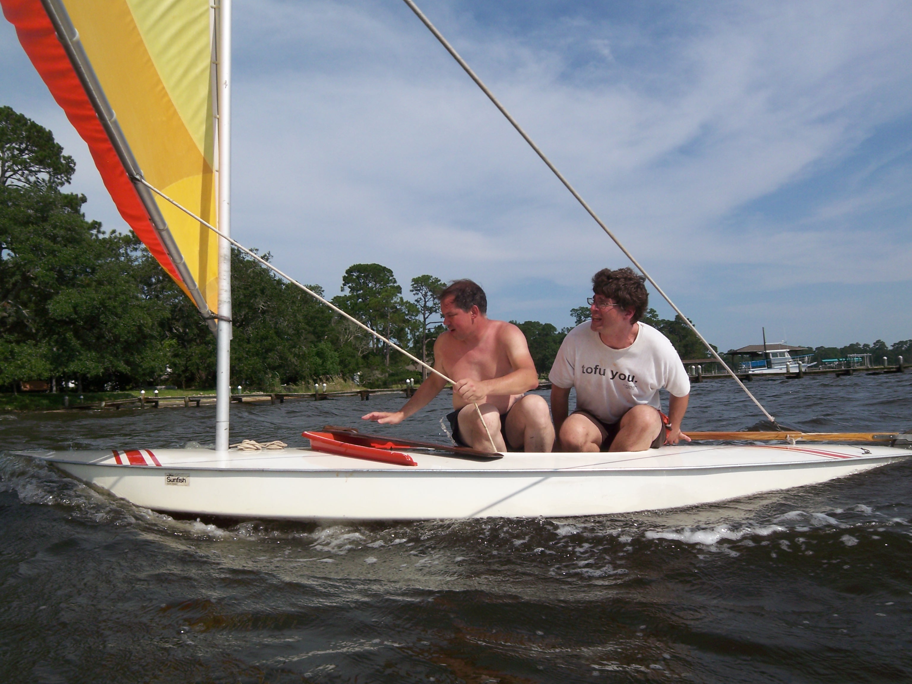 David Rhoden and Trey Ledford sailing a Sunfish in Perdido Bay
