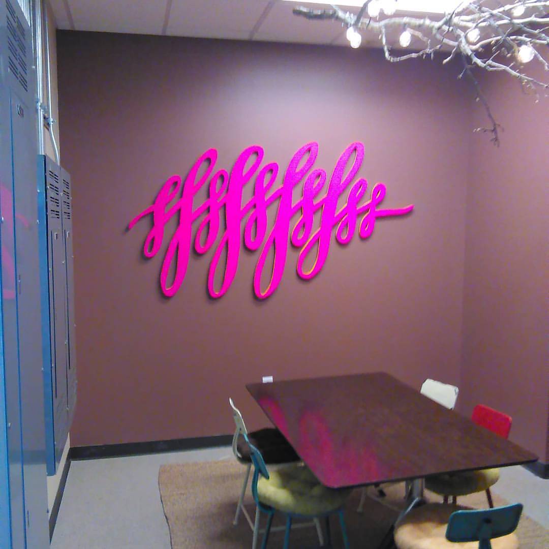 Pink squiggle on office wall