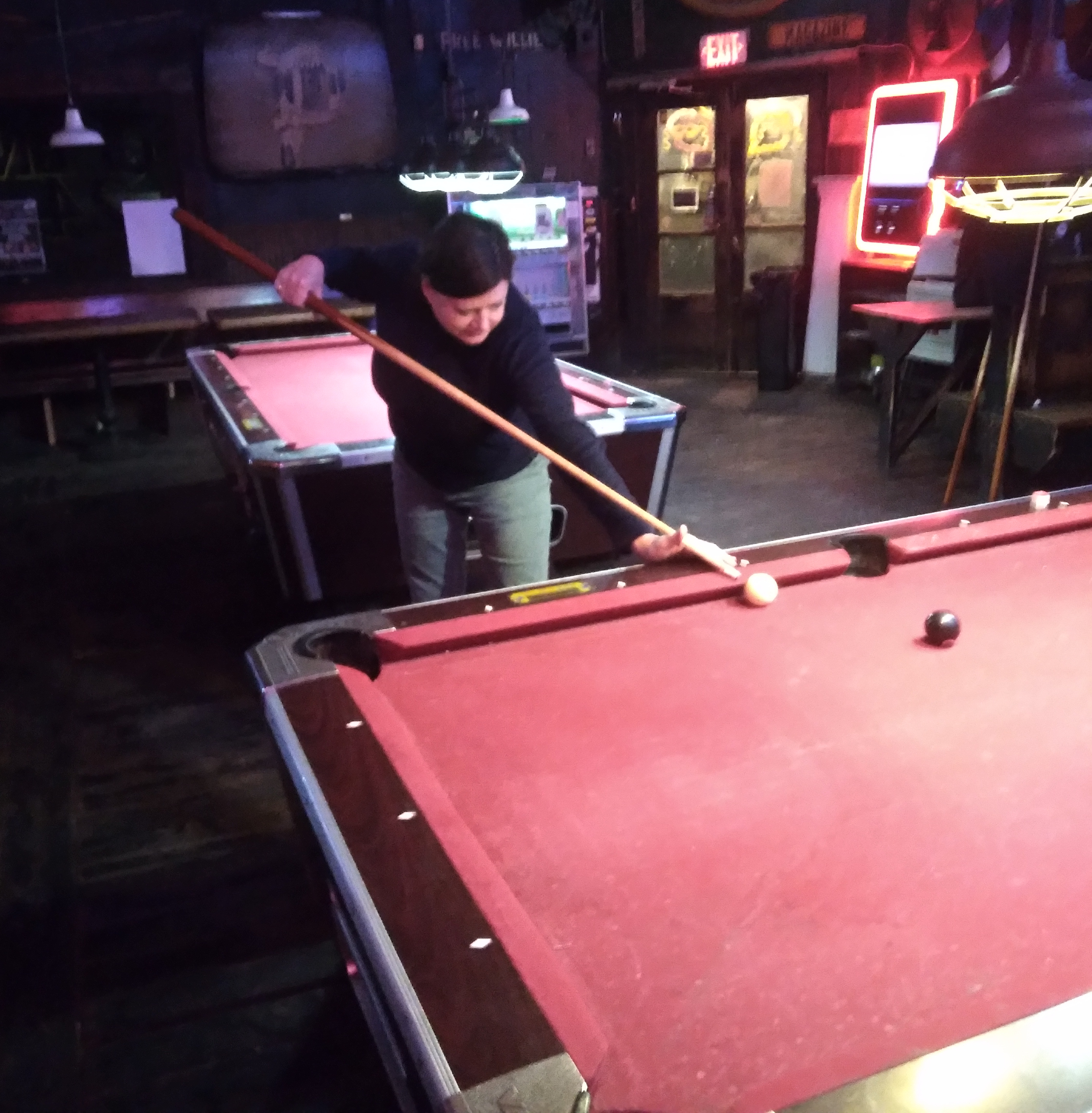 Dana playing pool at Le Bon Temps