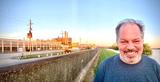 Standing on the levee near the sugar plant.