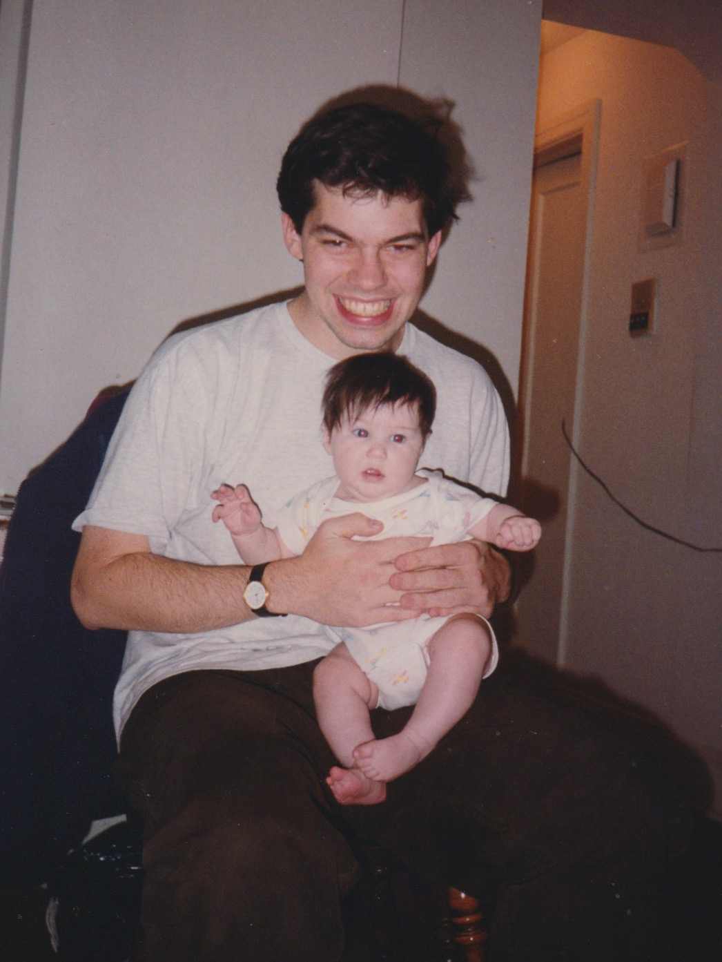 David Rhoden holding baby Madeline Barr, 1993