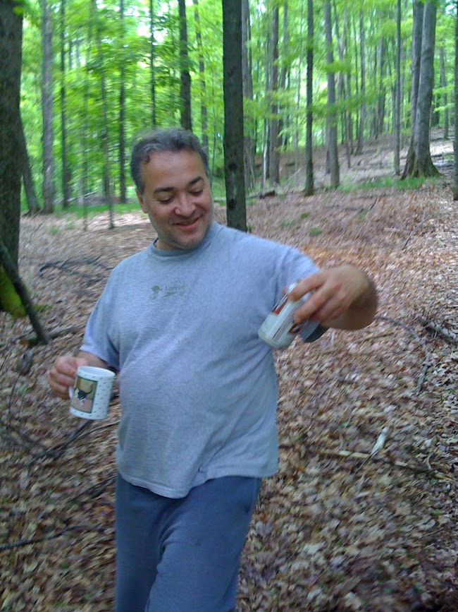 Doug DeRienzo shooting cans in the woods