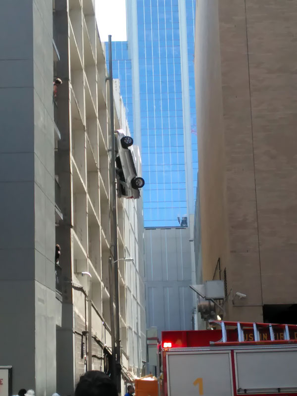 Car hanging from parking garage on Sixth Street in Austin, September 9, 2016.