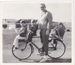 Me, Beverly, and Matt on a bike with our dad, about 1971.