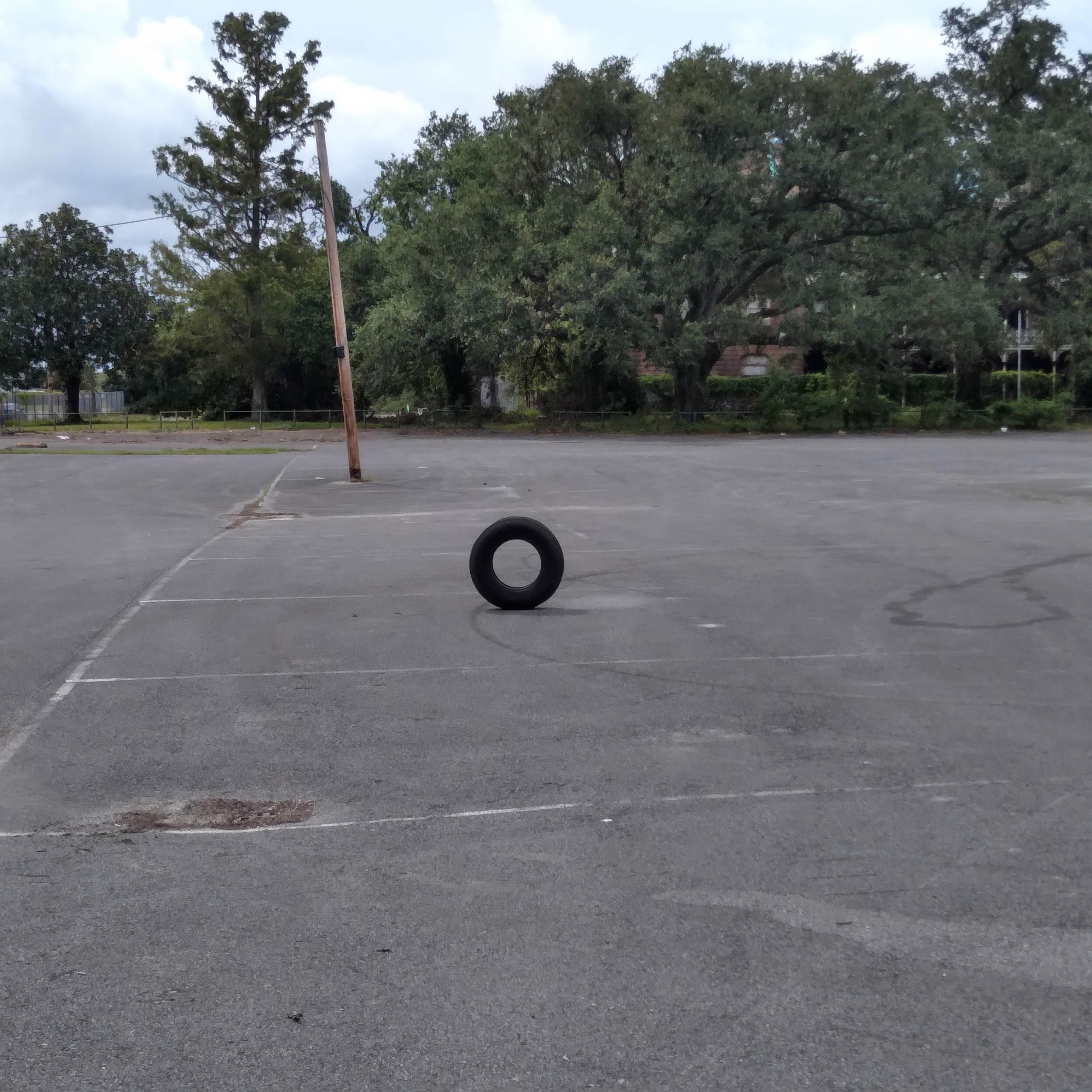 Standing tire in Holy Cross parking lot, New Orleans, Louisiana, October 5, 2021
